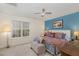 Comfortable bedroom featuring a ceiling fan and bright window at 2225 Whistling Straits Way, Raleigh, NC 27604
