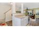 Inviting view of kitchen and open living area featuring bar seating and modern decor at 2225 Whistling Straits Way, Raleigh, NC 27604