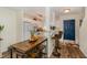 Bright kitchen featuring white cabinets, modern appliances, breakfast bar, and adjacent dining area at 2225 Whistling Straits Way, Raleigh, NC 27604