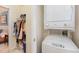 The house has laundry closet with stacked washer and dryer and some storage at 2225 Whistling Straits Way, Raleigh, NC 27604
