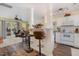 Bright, open-concept kitchen with bar seating, seamlessly connected to the living room and dining area at 2225 Whistling Straits Way, Raleigh, NC 27604