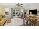 Inviting living room with plush carpet, comfortable seating, and bright natural light from sliding glass doors at 2225 Whistling Straits Way, Raleigh, NC 27604