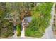Overhead view of a cozy home surrounded by trees in a serene neighborhood at 2400 Perennial St, Raleigh, NC 27603