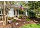Inviting front porch and landscaped garden in front of this well-maintained home at 2400 Perennial St, Raleigh, NC 27603