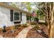 Attractive home exterior with a brick foundation and thoughtfully designed landscaping at 2400 Perennial St, Raleigh, NC 27603