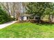 Charming home with a lush lawn, mature trees, and inviting curb appeal at 2400 Perennial St, Raleigh, NC 27603