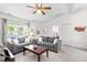 Comfortable living room featuring cozy sofas, ceiling fan, and neutral decor at 2400 Perennial St, Raleigh, NC 27603