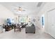 Cozy living room featuring neutral decor, soft carpet, and open doorway at 2400 Perennial St, Raleigh, NC 27603