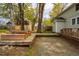 Backyard with wooden deck and walkway leads to the shed at 2422 S Alston Ave, Durham, NC 27713
