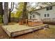 Large wooden deck perfect for outdoor entertaining, complete with built-in seating and planters at 2422 S Alston Ave, Durham, NC 27713