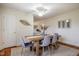 Light-filled dining room featuring a rustic table with modern chairs and simple decorations at 2422 S Alston Ave, Durham, NC 27713