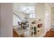 Open-concept dining room featuring a rustic table, updated chairs, and decorative shelving at 2422 S Alston Ave, Durham, NC 27713