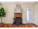 A charming brick fireplace with a white mantle enhances the appeal of this home at 2422 S Alston Ave, Durham, NC 27713