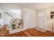 Inviting foyer with hardwood floors, built-in shelving, and a staircase leading to the upper level at 2422 S Alston Ave, Durham, NC 27713