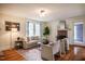 Inviting living room boasts a decorative fireplace, neutral tones, and hardwood flooring at 2422 S Alston Ave, Durham, NC 27713