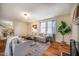 Bright living room with a decorative fireplace, hardwood floors, and comfortable seating area at 2422 S Alston Ave, Durham, NC 27713