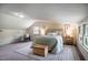 Bright main bedroom featuring a sitting chair, lots of natural light, and decor at 2422 S Alston Ave, Durham, NC 27713