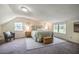 Spacious main bedroom with a cozy seating area and lots of natural light at 2422 S Alston Ave, Durham, NC 27713