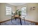 Home office with natural light, hardwood floors, and a stylish area rug at 2422 S Alston Ave, Durham, NC 27713
