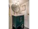 Stylish powder room featuring a dark vanity with brass hardware and a modern faucet at 2422 S Alston Ave, Durham, NC 27713