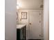 Charming powder room with dark green vanity and brass hardware at 2422 S Alston Ave, Durham, NC 27713