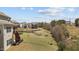 Spacious backyard featuring a pond, other homes, and wooded land at 2713 Tunstall Grove Dr, Apex, NC 27523