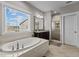 Beautiful bathroom with a soaking tub, granite counters, and walk in shower at 2713 Tunstall Grove Dr, Apex, NC 27523