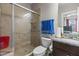 Bathroom features a tiled shower, granite countertop, and dark wood vanity for a modern look at 2713 Tunstall Grove Dr, Apex, NC 27523