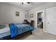 Bedroom with a dark wood frame bed, desk, and attached bathroom for added convenience at 2713 Tunstall Grove Dr, Apex, NC 27523