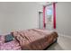 Relaxing bedroom with simple decor, natural light, and comfortable bedding at 2713 Tunstall Grove Dr, Apex, NC 27523