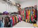 Walk in closet with plentiful shelving and storage solutions for all of your wardrobe needs at 2713 Tunstall Grove Dr, Apex, NC 27523