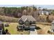 Charming two-story home with stone accents, a well-manicured lawn, and an attached two-car garage at 2713 Tunstall Grove Dr, Apex, NC 27523