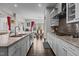 Stylish kitchen flows into the dining area, equipped with modern appliances and granite countertops, perfect for Gathering meals at 2713 Tunstall Grove Dr, Apex, NC 27523