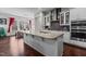 Gourmet kitchen with granite countertops, stainless steel appliances, and a spacious island perfect for entertaining at 2713 Tunstall Grove Dr, Apex, NC 27523