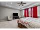 Spacious main bedroom featuring a sitting area, ceiling fan and tray ceiling for a luxurious feel at 2713 Tunstall Grove Dr, Apex, NC 27523