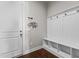 Mudroom is equipped with built-in storage, a coat rack, and seating, providing an organized space for everyday essentials at 2713 Tunstall Grove Dr, Apex, NC 27523