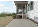 Backyard featuring a screened-in porch, patio, and plenty of green space at 288 Whispering Wind Dr, Chapel Hill, NC 27516