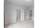 Open bedroom featuring multiple doorways leading to other rooms within the house at 288 Whispering Wind Dr, Chapel Hill, NC 27516