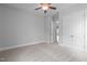This carpeted bedroom offers a ceiling fan and a double door closet at 288 Whispering Wind Dr, Chapel Hill, NC 27516