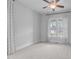 Bedroom featuring carpeted floor, ceiling fan, and a double window at 288 Whispering Wind Dr, Chapel Hill, NC 27516