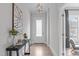Bright entryway with hardwood floors, white trim, and elegant decor at 288 Whispering Wind Dr, Chapel Hill, NC 27516