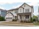 Charming two-story home with a covered front porch and an attached two-car garage at 288 Whispering Wind Dr, Chapel Hill, NC 27516