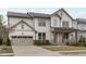 Charming two-story home with a covered front porch and an attached two-car garage at 288 Whispering Wind Dr, Chapel Hill, NC 27516