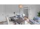Well-lit office featuring a desk and two upholstered chairs set on an area rug at 288 Whispering Wind Dr, Chapel Hill, NC 27516