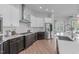 Modern kitchen with dark cabinets, stainless steel appliances and gas range at 288 Whispering Wind Dr, Chapel Hill, NC 27516