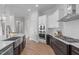 Modern kitchen with dark cabinets, stainless steel appliances and gas range at 288 Whispering Wind Dr, Chapel Hill, NC 27516