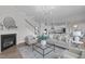 Bright and open living room next to kitchen with fireplace and stylish decor at 288 Whispering Wind Dr, Chapel Hill, NC 27516