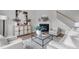 Bright living room boasts fireplace, stairs and stylish decor at 288 Whispering Wind Dr, Chapel Hill, NC 27516