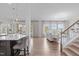 Open-concept living space featuring hardwood floors, recessed lighting, and lots of natural light at 288 Whispering Wind Dr, Chapel Hill, NC 27516