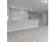 Spacious, neutral living room with plush carpeting and recessed lighting at 288 Whispering Wind Dr, Chapel Hill, NC 27516